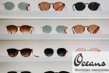 black framed sunglasses on white surface