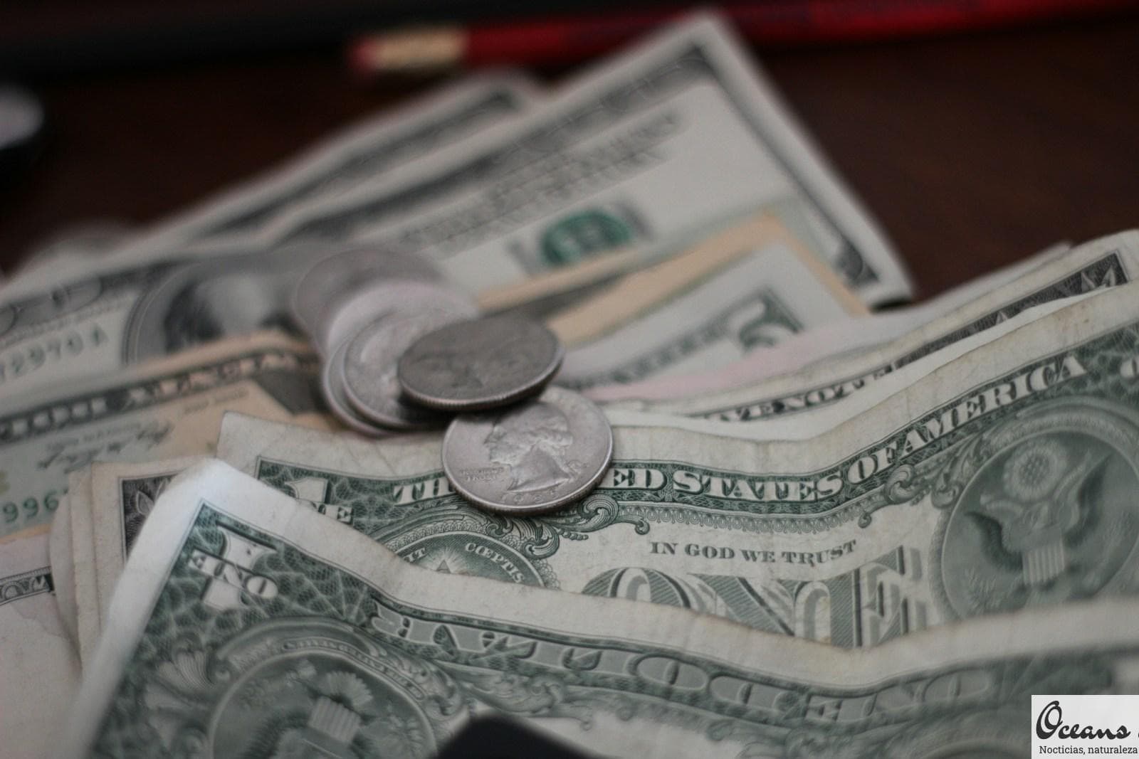 photo of dollar coins and banknotes